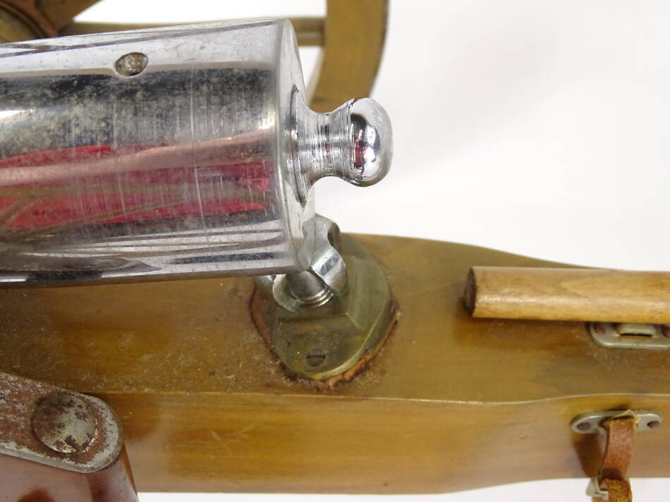 A miniature artillery type cannon, with chrome plated barrel, hardwood
