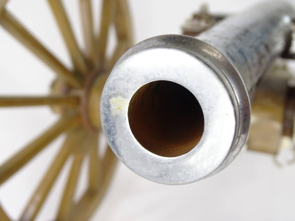 A miniature artillery type cannon, with chrome plated barrel, hardwood