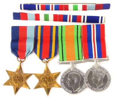 A WWII medal group, comprising the 1939-45 Star, the Burma Star, the 1939-45 the Defence medal, the 1935-45 War medal, and two medal bars.