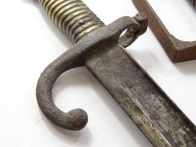 Two 19thC swords, each with a curved blade, one with a shagreen handle, the other leather and metal wire, lacking scabbards, and a bayonet, with brass handle and scabbard, 70cm long etc. (3) - 5