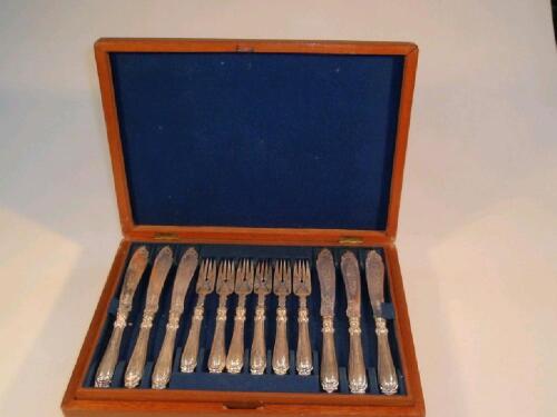 18 pairs of silver plated fish knives and forks engraved decoration and ornate handles