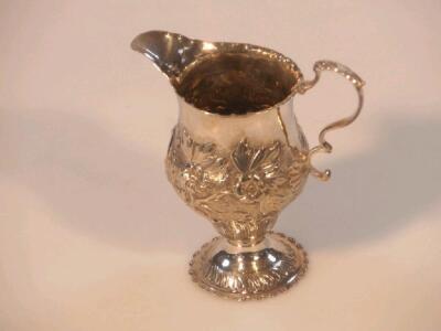 A George III silver helmet cream jug