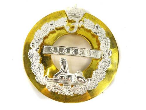 An Alamein regimental badge, 9.5cm diameter.