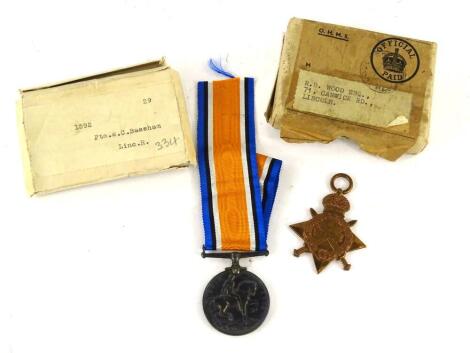 A WWI service medal, marked Private W C Bassham 1592 Lincolnshire Regiment, and companion 1914-15 Star. (2)