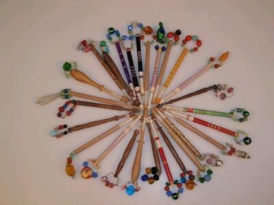 A collection of approximately 44 lace bobbins