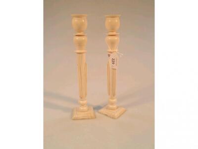 A pair of late 19thC ivory candlesticks