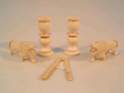 A pair of early 20thC ivory small candlesticks