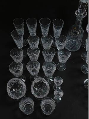 A Waterford Crystal part suite of cut glass tableware decorated in the Lismore pattern, comprising decanter and stopper, pair of brandy balloons, six hock glasses, five champagne flutes, four red wine glasses, six white wine glasses, ten further stem glas - 3