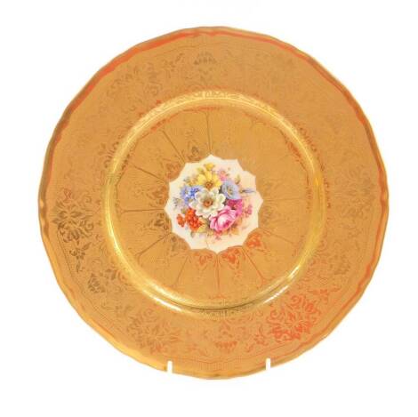 A Royal Worcester porcelain cabinet plate, circa 1958, painted by Freeman, with flowers, within a tooled gilt ground and border, printed mark, 27cm Dia.