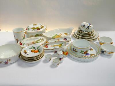 A group of Royal Worcester oven to table ware decorated in the Evesham pattern, including flan dishes, casserole, plates, bowls and dishes. (quantity)