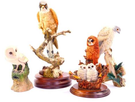 A Country Artists sculpture modelled as a Kestrel, CA06489., Worcester figure group of an owl and two chicks, Sherratt & Simpson bird of prey, and a Arden's Sculptures barn owl. (4)