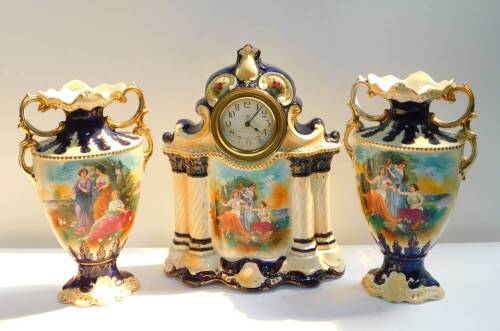 An early 20thC Staffordshire pottery clock garniture, the clock with circular dial bearing Arabic numerals, Continental clockwork movement, the case of rococo scrolling form, raised on four integral spiral fluted columns, transfer decorated with classical