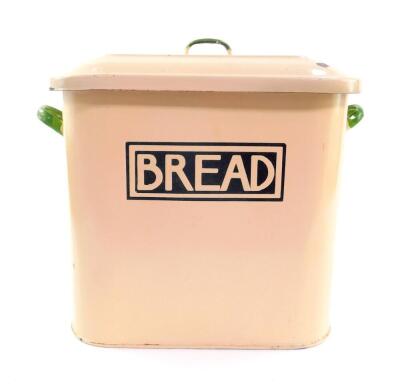 A mid 20thC enamel twin handled bread bin and cover, cream with green handles, 31cmH, 40cm W, 25cm D.