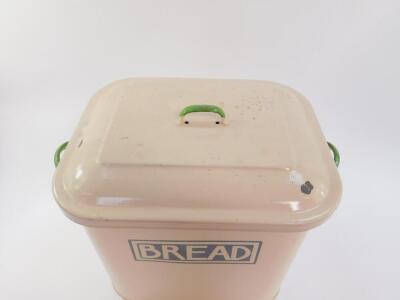 A mid 20thC enamel twin handled bread bin and cover, cream with green handles, 31cmH, 40cm W, 25cm D. - 2