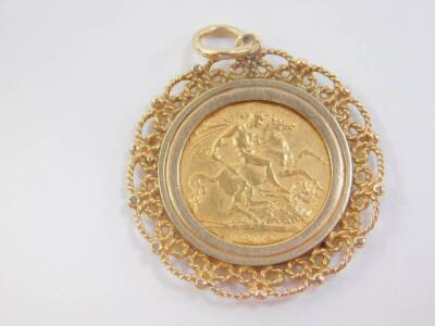 A George V gold half sovereign 1912, in a 9ct gold pendant mount, 7.0g. - 2