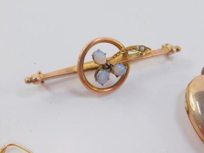 A Victorian opal and seed pearl floral bar brooch, set in yellow metal, stamped 9ct, three pairs of 9ct gold earrings, one set with small cultured pearls, 6.6g., and a heart shaped photo locket, set with a cross to the front, with seed pearls and rubies, - 2