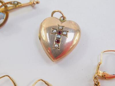 A Victorian opal and seed pearl floral bar brooch, set in yellow metal, stamped 9ct, three pairs of 9ct gold earrings, one set with small cultured pearls, 6.6g., and a heart shaped photo locket, set with a cross to the front, with seed pearls and rubies, - 3