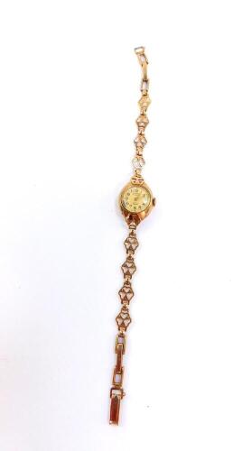 A Rotary lady's 9ct gold cased wristwatch, circular dial bearing Arabic numerals, 17 jeweled movement, on a 9ct gold fancy link strap, 12.2g.