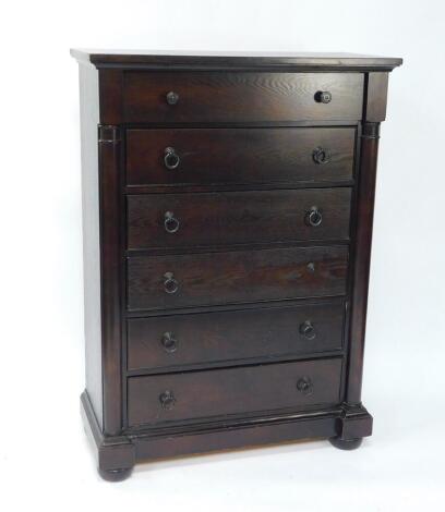 A Chinese Victorian style dark oak chest, with six long drawers flanked by demi pilasters, raised on a plinth base and bun feet, 102.5cm W, 45.5cm D, 143cm H.