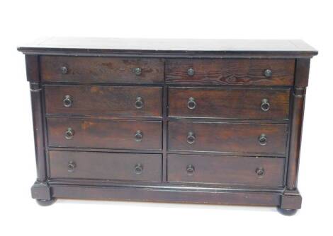 A Chinese Victorian style dark oak dresser, with eight drawers flanked by demi pilasters, raised on a plinth above bun feet, 167.5cm W, 45.5cm D, 102cm H.