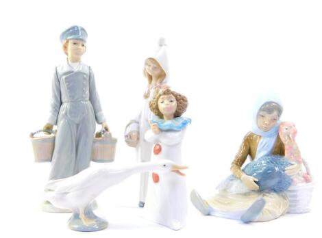 Four Lladro porcelain figures, comprising a boy carrying two water buckets, girl in nightgown, seated girl with a basket of apples and holding a turkey and a goose, together with a Nao figure of a clown girl. (AF), (5)