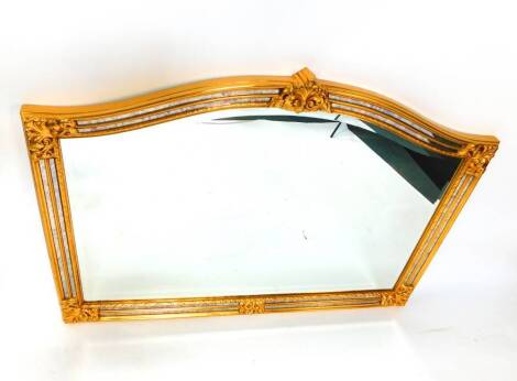 A C P Productions Premier Collection gilt wood overmantel mirror, with moulded leaf decoration, inset bevel glass, 128cm W, 89cm H.