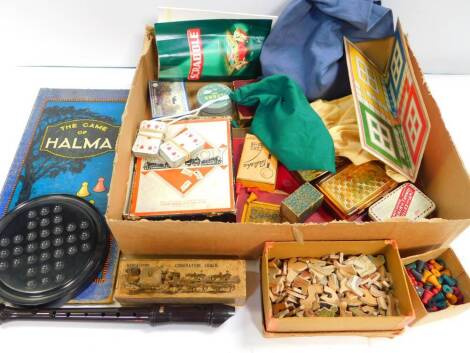 A Tabloid Tea tin, containing solitaire balls, solitaire board, jigsaw puzzle, cards, board game, etc.