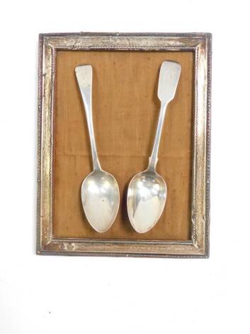 A George IV silver dessert spoon, initial engraved, London 1831, Victorian dessert spoon, initial engraved, London 1843, 2.29oz, and a George V silver strut photograph frame of rectangular section appeture, 19cm x 14cm, frame 22.5cm x 17.5cm, Birmingham 1