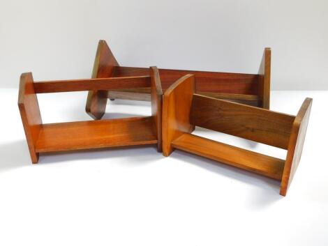 A mahogany book trough, 49cm W., walnut book trough, 30.5cm W., and a further book trough with leaf carved ends, 32cm W. (3)