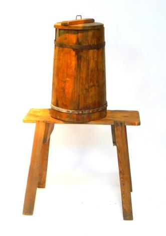 A Victorian pine and iron bound butter churn, 63cm H, with a pine stand, the rectangular top raised on four outswept rectangular legs, 66cm H, 76.5cm W, 27cm D.