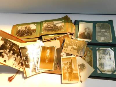 Deltiology. Two albums of postcards and photo cards, chiefly portraits and group cards, some relating to Peterborough, including Brotherhoods's football team, fire appliances of the Old Fletton Fire Service, discharged soldiers and sailors on church parad