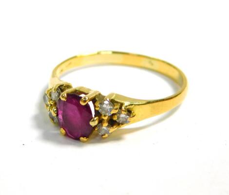 A ruby solitaire ring, with diamond set shoulders in yellow metal, ruby approximately 3/4 carat, size P, 2.7g.