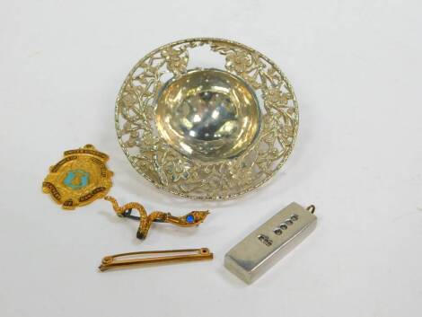 A Victorian gilt metal serpent brooch, rolled gold pin, a badge for United Kingdom Alliance of Professional Teachers of Dancing, a silver plated ingot, and a Chinese silver tea strainer, with pierced and embossed prunus blossom decoration, 0.95oz. (AF) (5