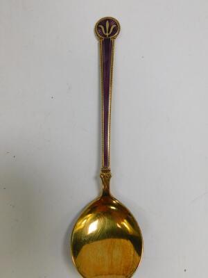 A Danish silver gilt and purple guilloche enamel salt spoon, bears hallmarks, 12.5cm L. (AF)