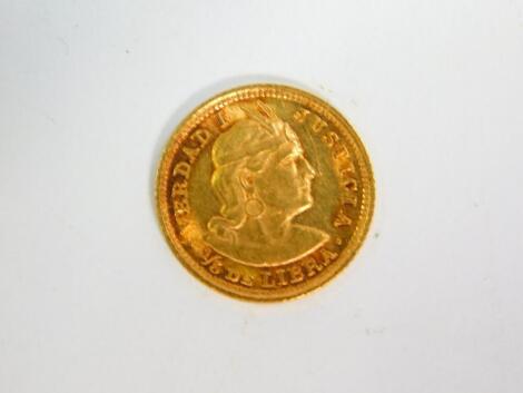 A Peruvian 1/5th De Libra gold coin 1907, 1.6g.