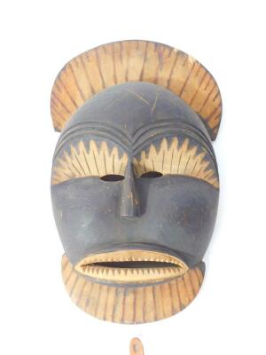 A tribal mask, 51cm H, 30cm W., fly swat, three bows and a spear, (6) - 2