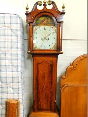 William Smith. A George III oak and mahogany crossbanded longcase clock. the break arch dial painted with medicine being administered to a wounded man, the circular dial bearing Arabic numerals, subsidiary seconds dial and date aperture, two train eight d - 2