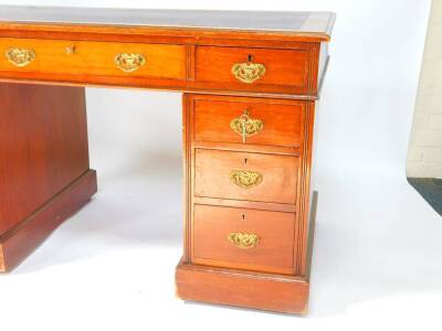 A Victorian mahogany twin pedestal desk, the rectangular top inset with tooled purple leather, over one long and two short drawers, above six graduated drawers, raised on plinth bases, on castors, 72.5cm high, 122.5cm wide, 64cm deep. - 3