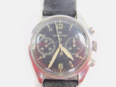 A Hamilton British Military RAF pilot's stainless steel chronograph wristwatch, dated 1972, the black dial bearing Arabic numerals and tritium luminous markers, military broad arrow and tritium T within circle marker, centre seconds hand, subsidiary thirt