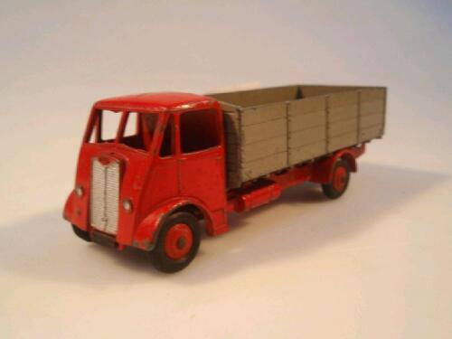 A Dinky Supertoy Guy wagon with red chassis and brown painted open back