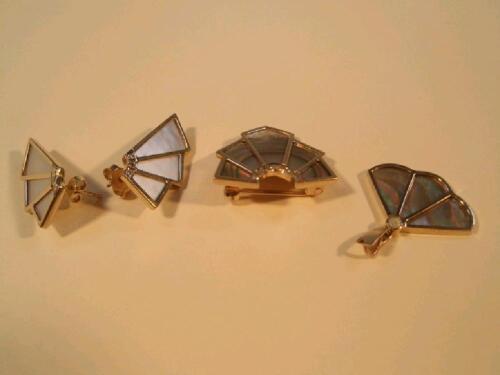 A 9ct gold abalone shell and tiny diamond set brooch