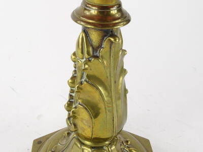 A late Victorian cranberry and brass oil lamp, with shaped floral milk glass shade, set with flowers with handkerchief top, on a pierced brass stand, marked Duplex, with a cranberry glass reservoir on an acanthus leaf stem and hexagonal base, 51cm high. - 3