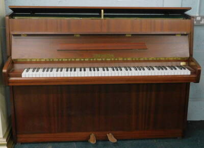 A modern Eisenberg over strung upright piano, in polished case marked to the interior, 106cm high, 145cm wide, 59cm deep.