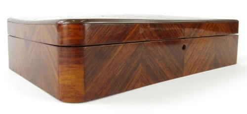 A 19thC kingwood and parquetry box, of rectangular form, with a slender domed lid, feather banded body and inlaid snowflake decoration, 6cm high, 22cm wide, 14cm deep.