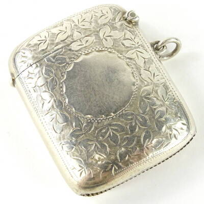 An Edwardian silver Vesta case, of shaped form with vacant cartouche, partially engine turned with silver gilt interior, Birmingham 1909, 6cm high, 1.3oz.