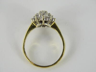 An 18ct gold diamond cluster ring, florally set with an arrangement of nineteen diamonds, central stone round brilliant 3.4mm x 1.8mm, approx 0.13cts with three tiers of graduating size small to large, ring head 1cm wide, on a plain shank marked 18ct, siz - 2