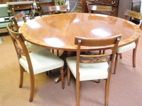 A fine quality reproduction Regency style single pillar dining table and six chairs