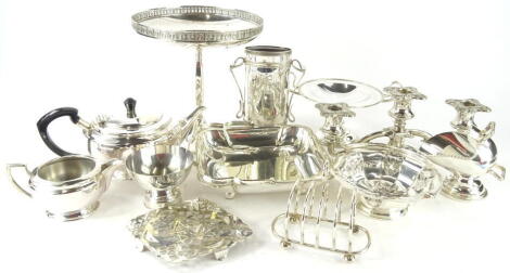 Various silver plated ware, a three branch candelabrum, 29cm wide, four sectional toast rack, tazza, bullet shaped teapot, open vegetable dish, helmet shaped sugar bowl (a quantity).