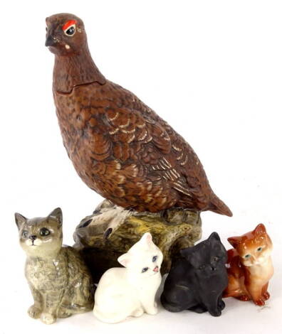 A Royal Doulton Matthew Gloag Famous Grouse whisky decanter with stopper, matt finish, 25cm high and various Beswick kittens to include one in black matt finish etc. (5).