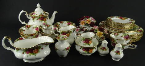 Various Royal Albert Old Country Roses teaware, comprising a teapot, 21cm high, six cups, gravy boat, milk jug, vase, salt and pepper pot, open sugar bowl, milk jug, six saucers, side plates and a shaped dish, three further posies, eight dinner plates and